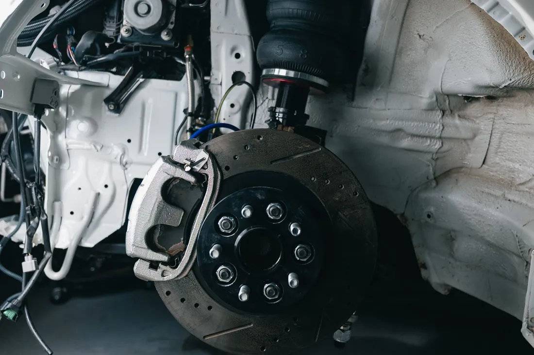 A vehicle suspension, hub and brake assembly with the wheel removed